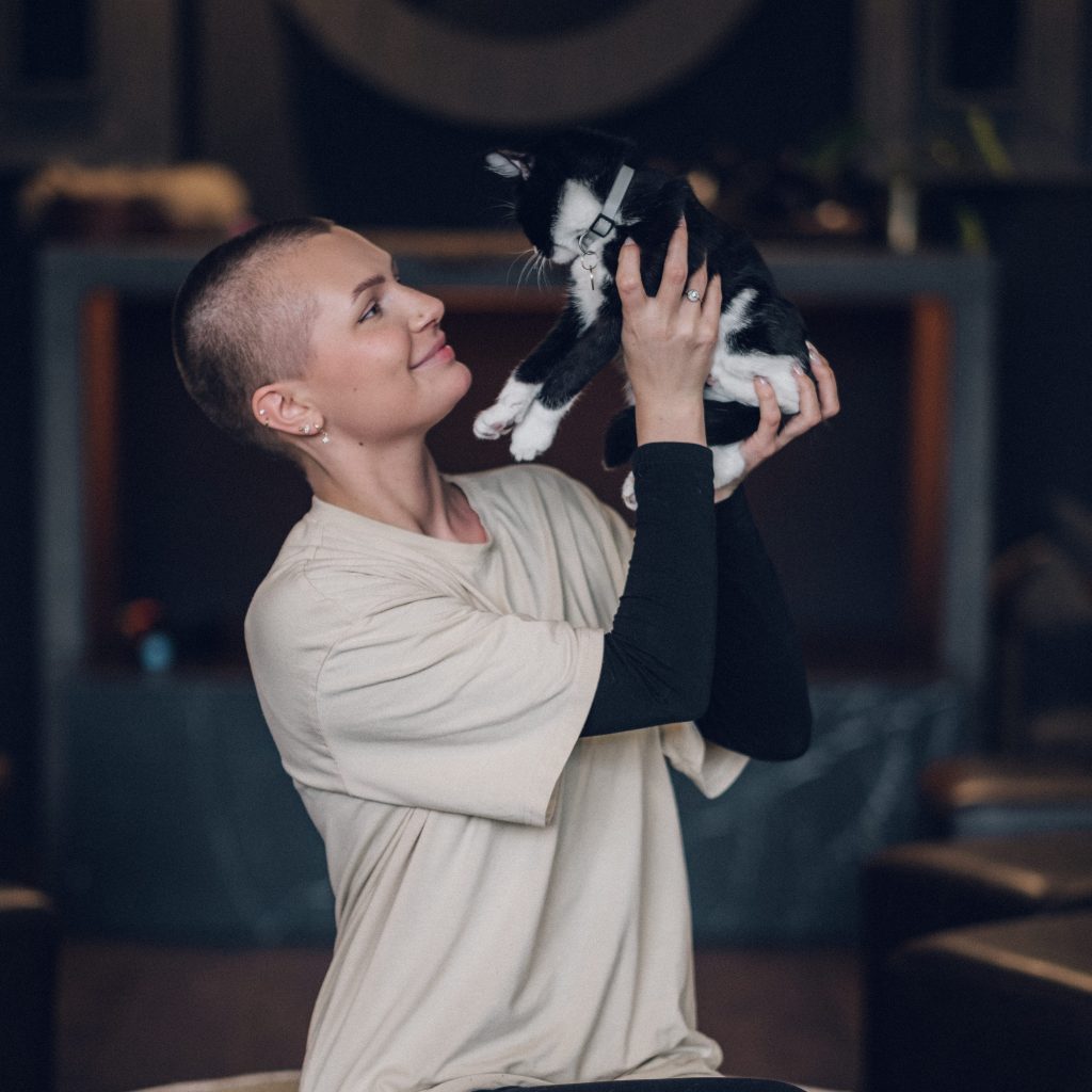 woman holding cute kitten