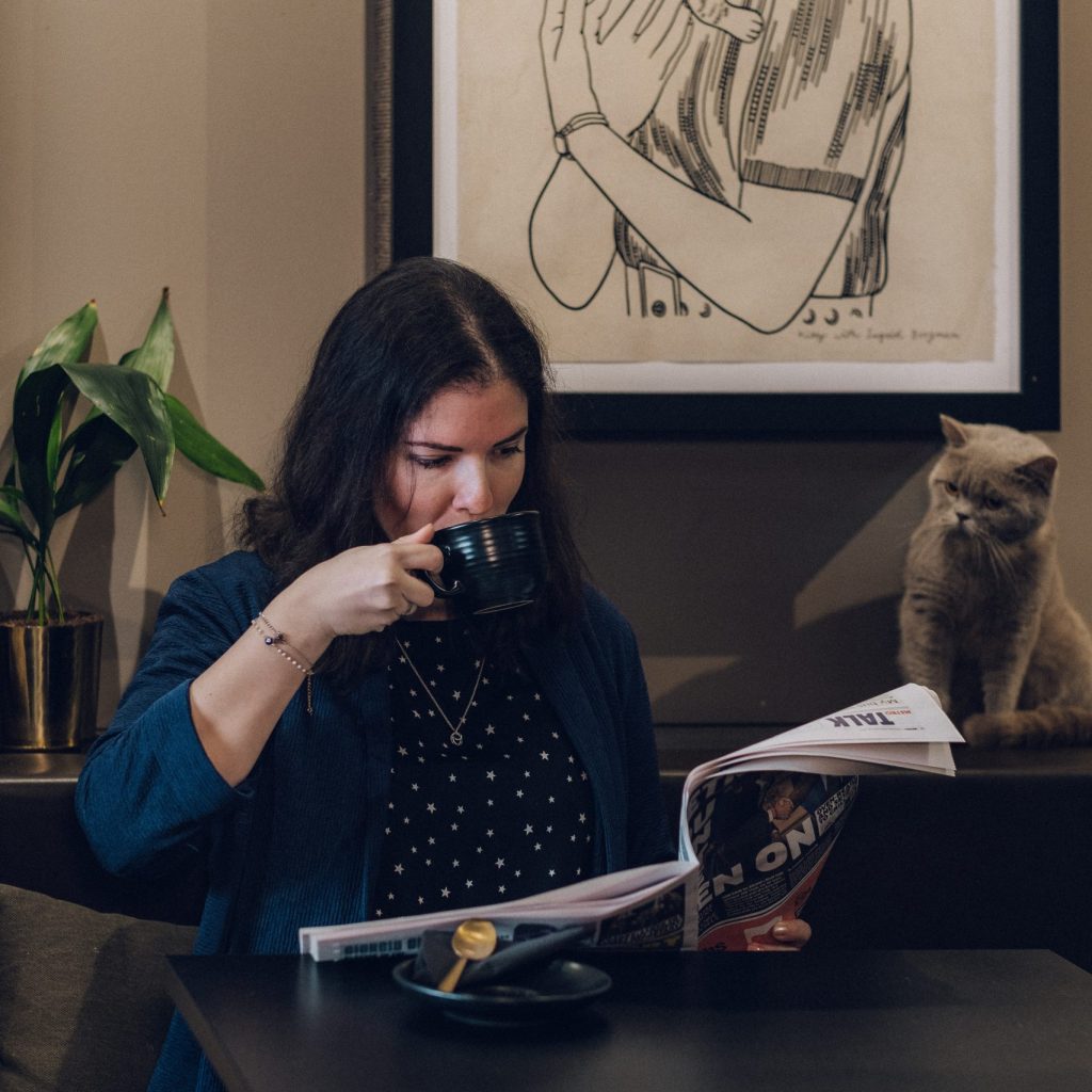 women relaxing in our cat café